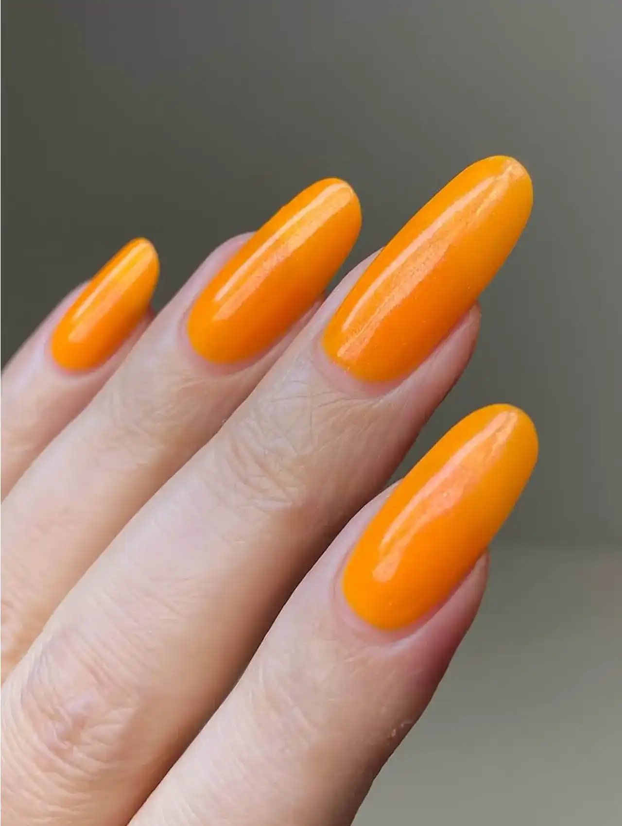 Neon jelly nails in bright orange polish