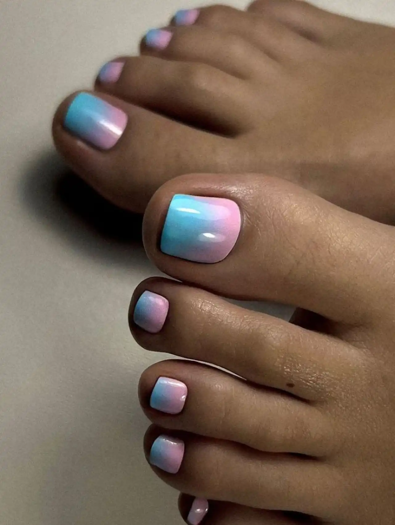 Blue ombre summer toe nail design with soft gradient effect