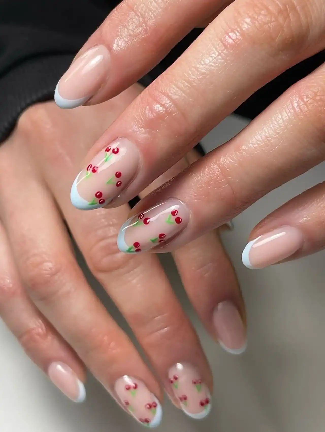 Cherry nail art with baby blue French tips, cute and trendy summer nail designs