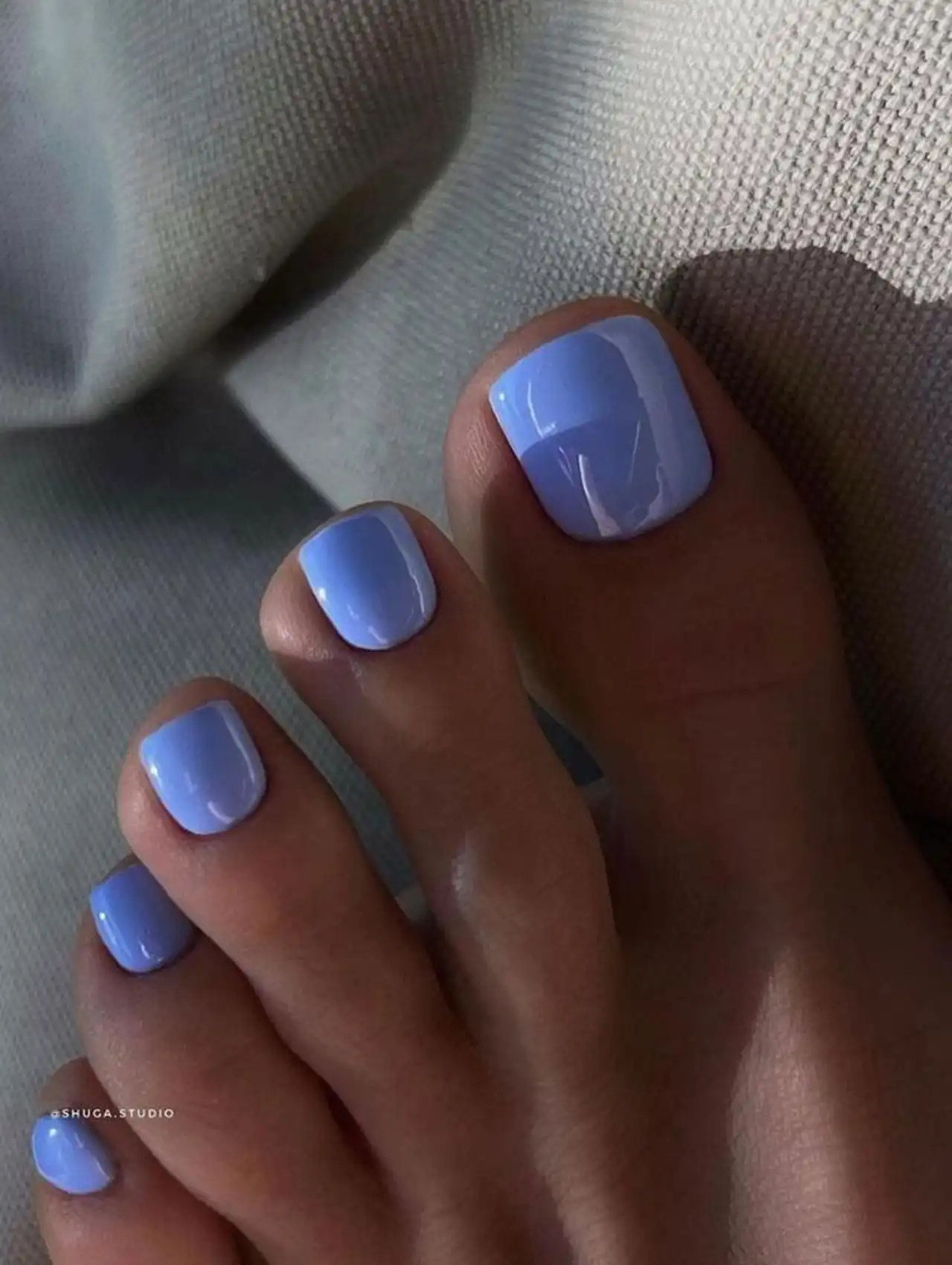 Clean light blue summer toe nail design with high-gloss finish