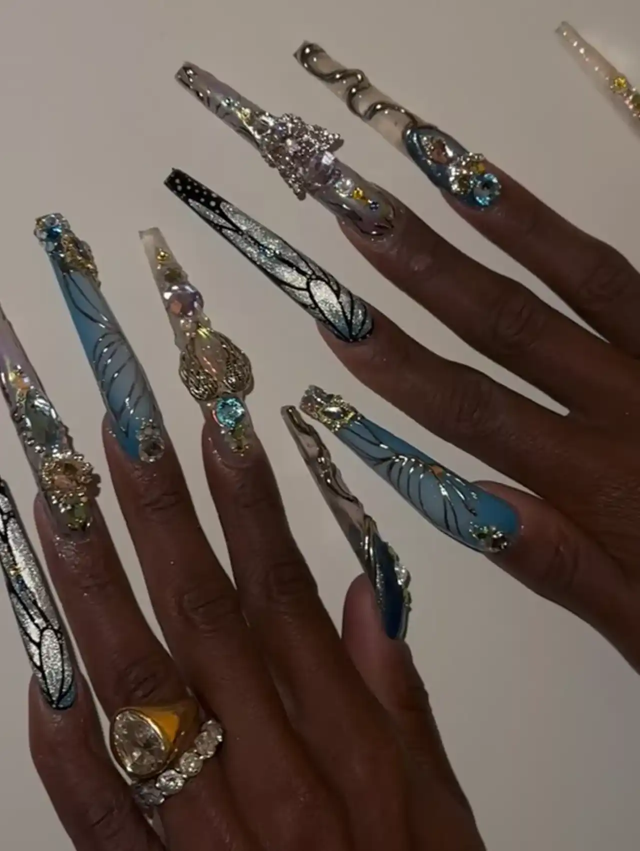 Cynthia Erivo with dramatic extra-long blue and silver embellished celebrity nails