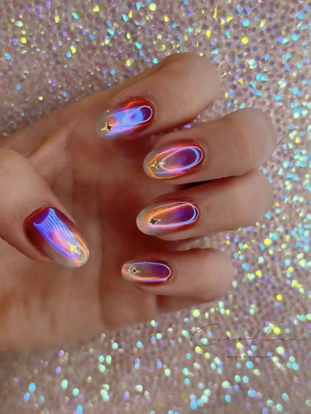 Multicolor chrome aurora nails with reflective shimmer showcasing aurora nail design ideas