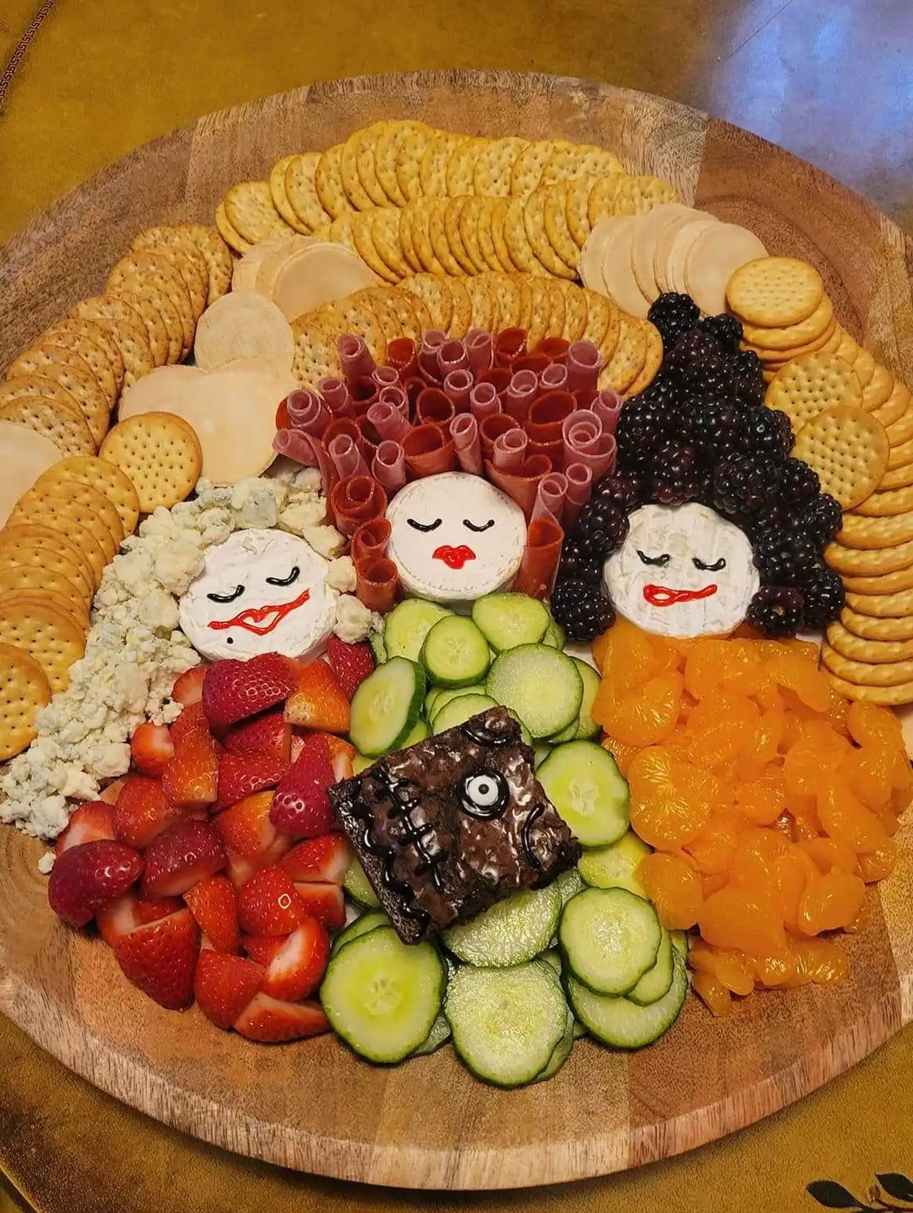 Hocus Pocus witches halloween charcuterie board with meats, cheeses, fruit, and crackers.
