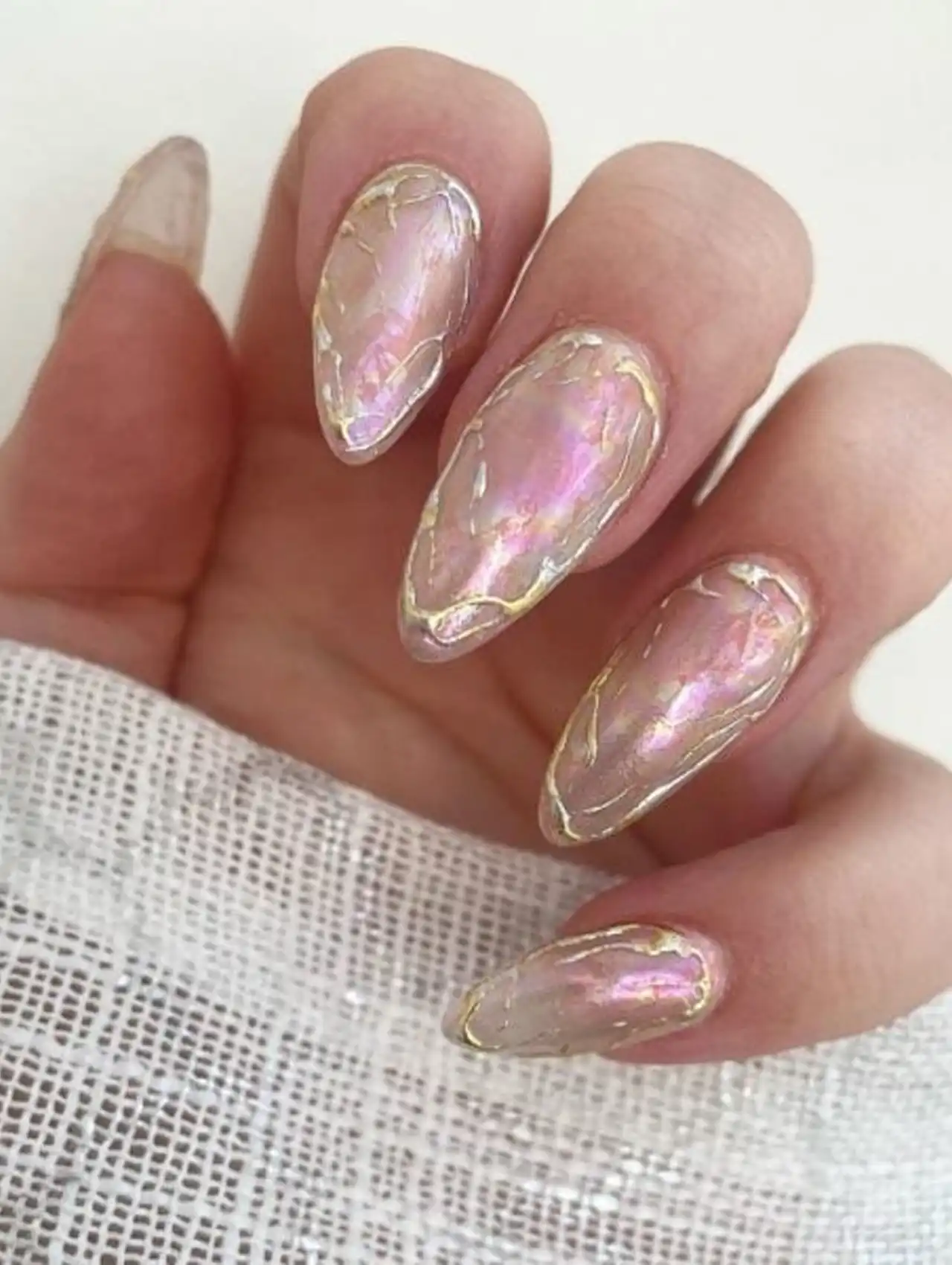 Pearl pink marble effect aurora nails showcasing aurora nail design ideas