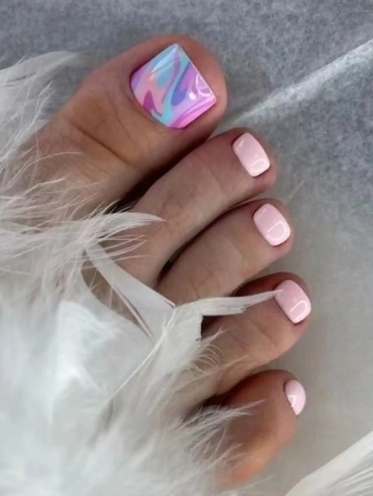 Pastel multicolor summer toe nail design with swirl effect