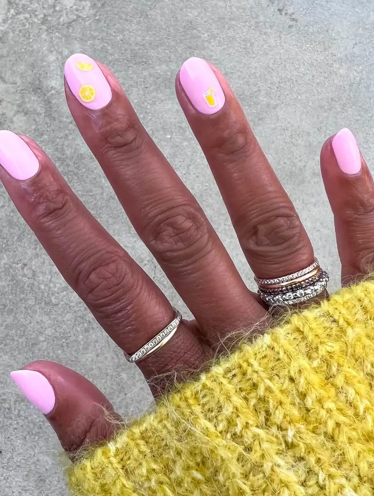 Pink nails with lemonade art accents – summer nail designs