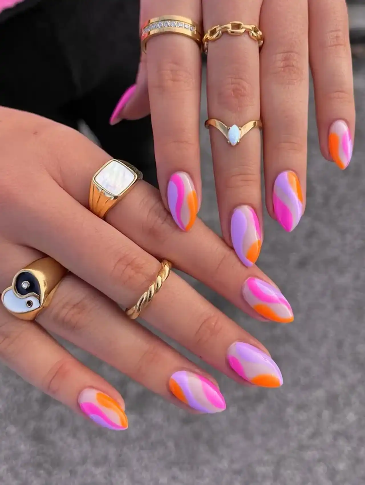 Pink and orange swirl abstract nails – summer nail designs