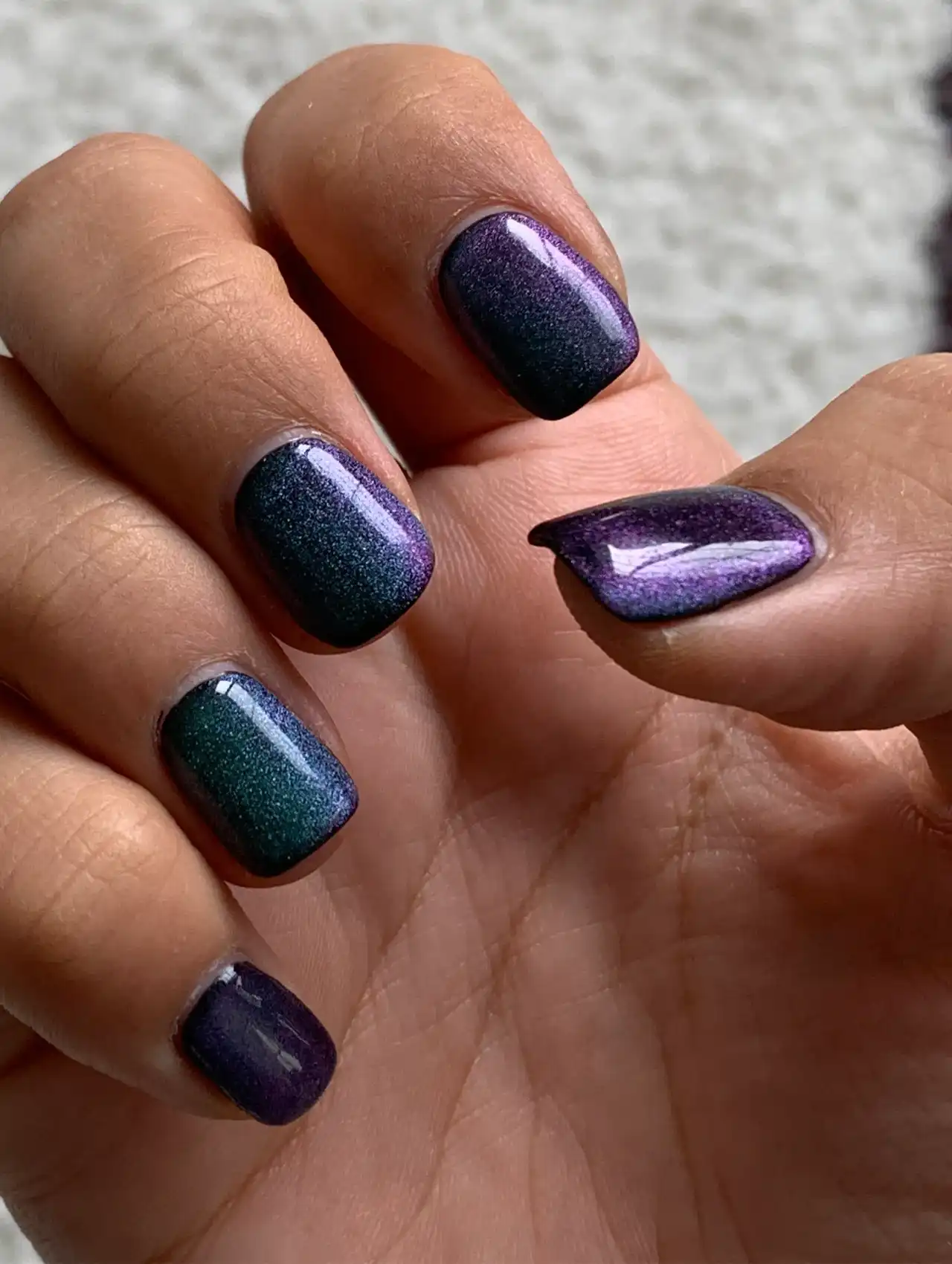 Dark purple chrome gradient nails showcasing aurora nail design ideas