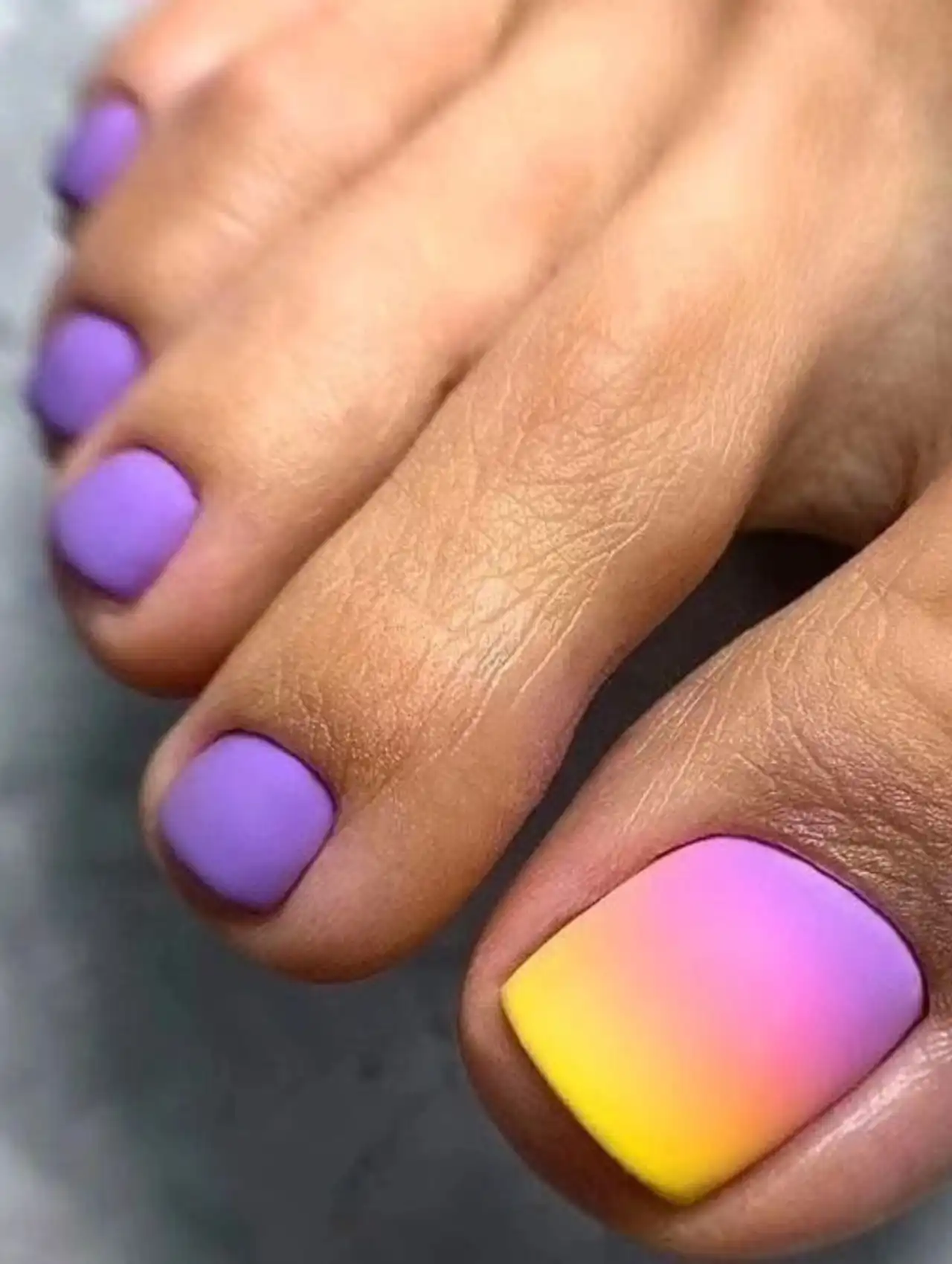 Purple and yellow gradient summer toe nail design with matte finish