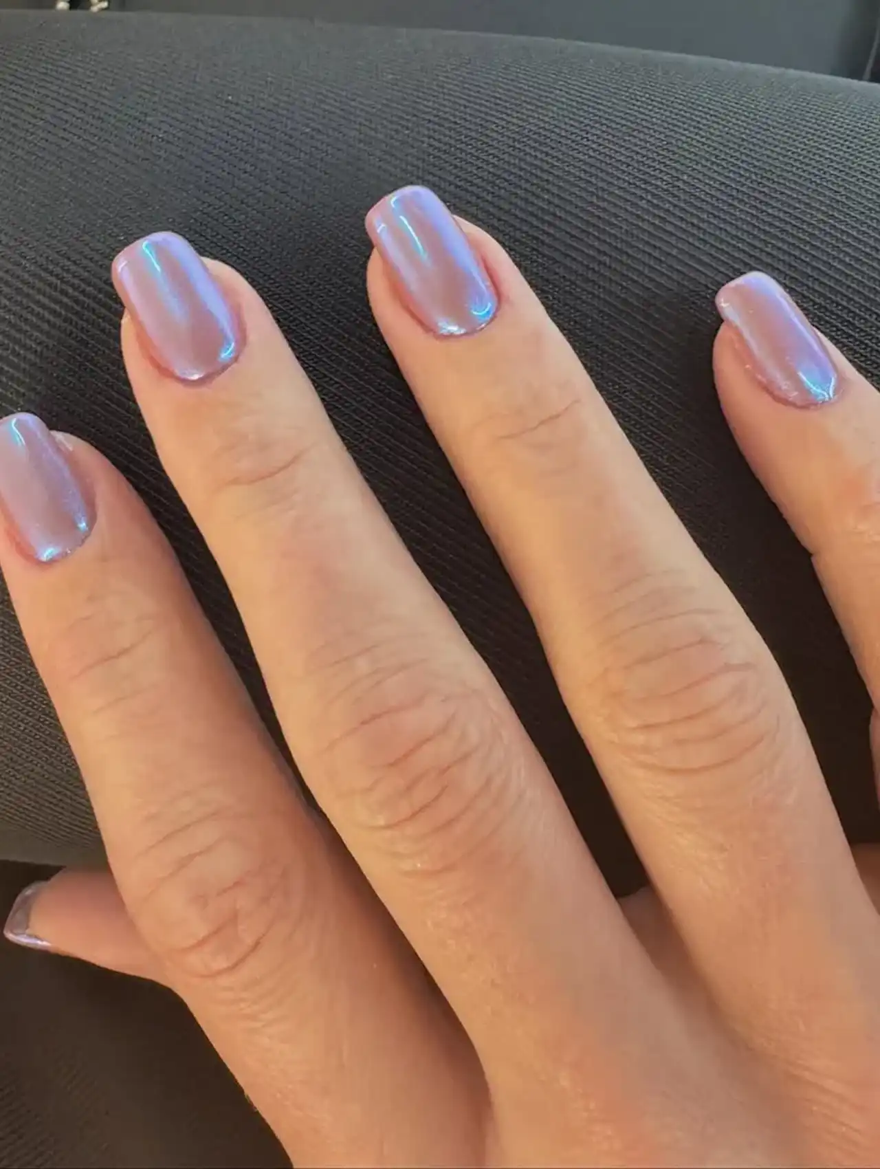 Short square nails with soft pink chrome glow showcasing aurora nail design ideas