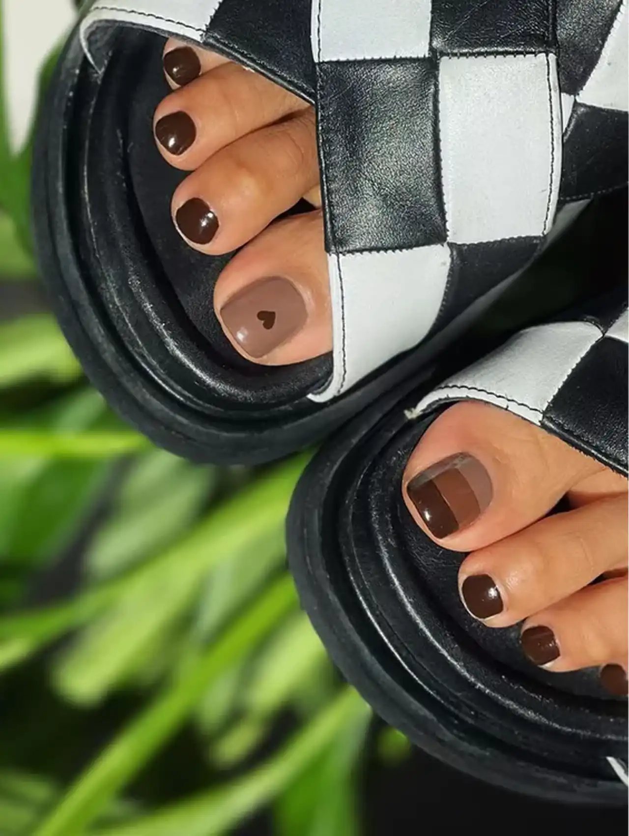 Tonal brown summer toe nail design with heart accent detail