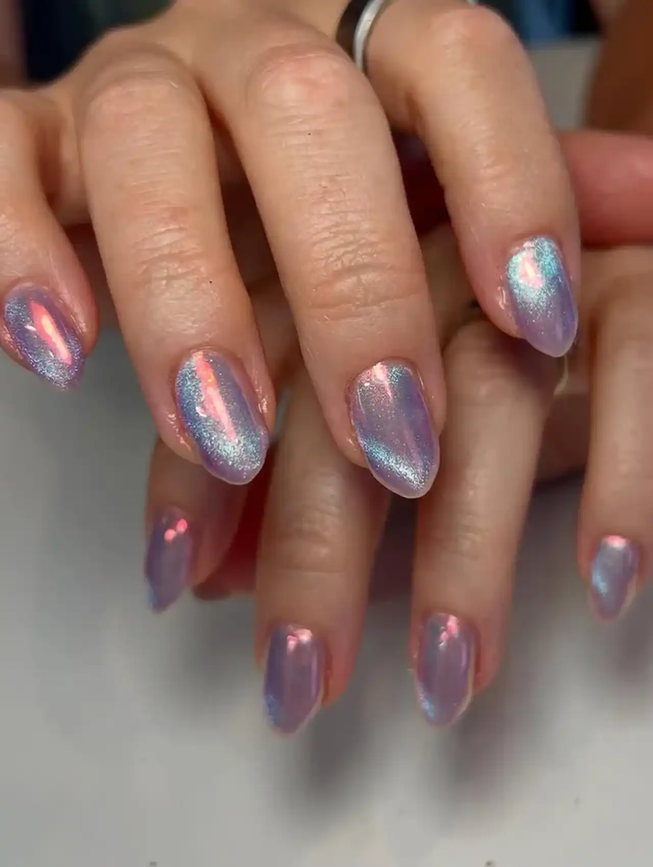 Purple velvet chrome nails with iridescent shimmer showcasing aurora nail design ideas