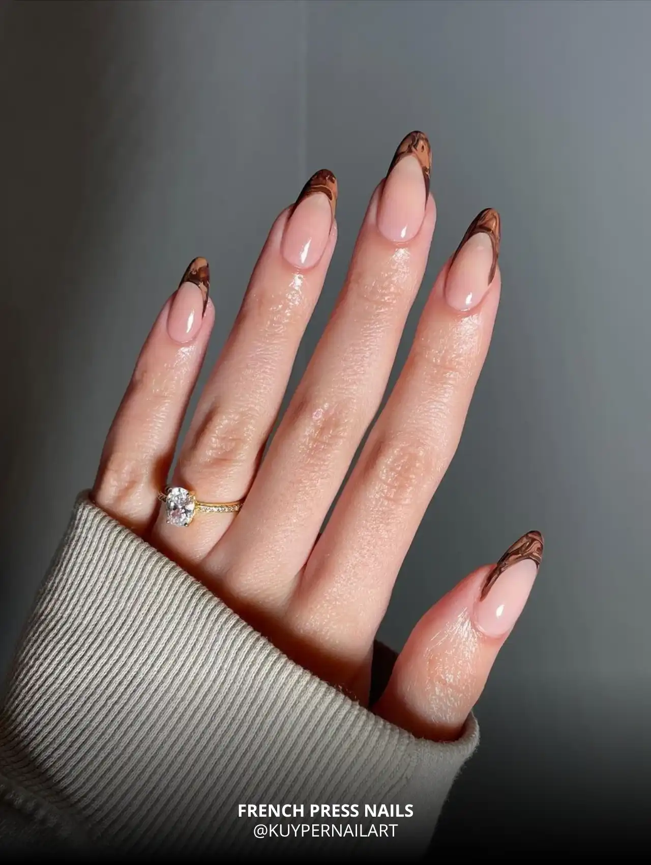 French press fall nail tips with brown marble effect.
