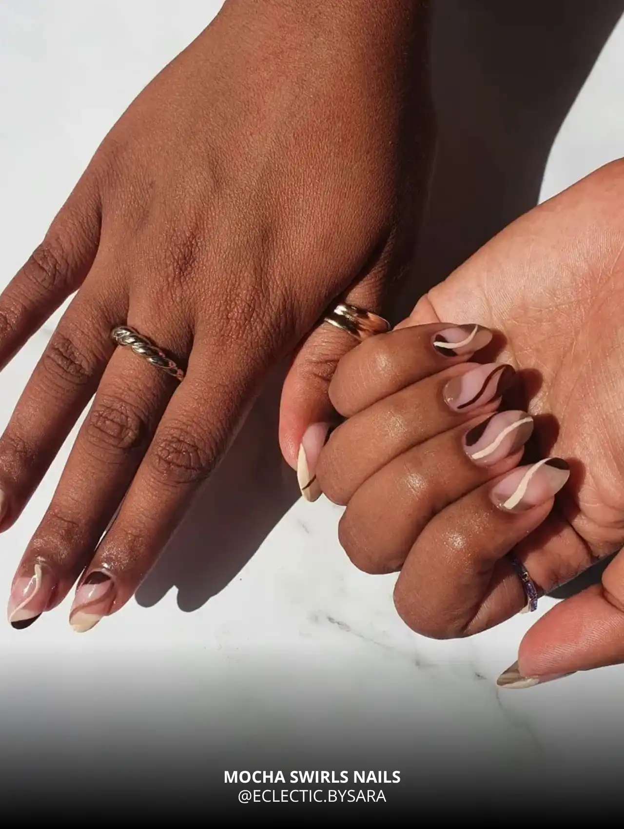 Mocha swirl fall nail art on medium skin tone