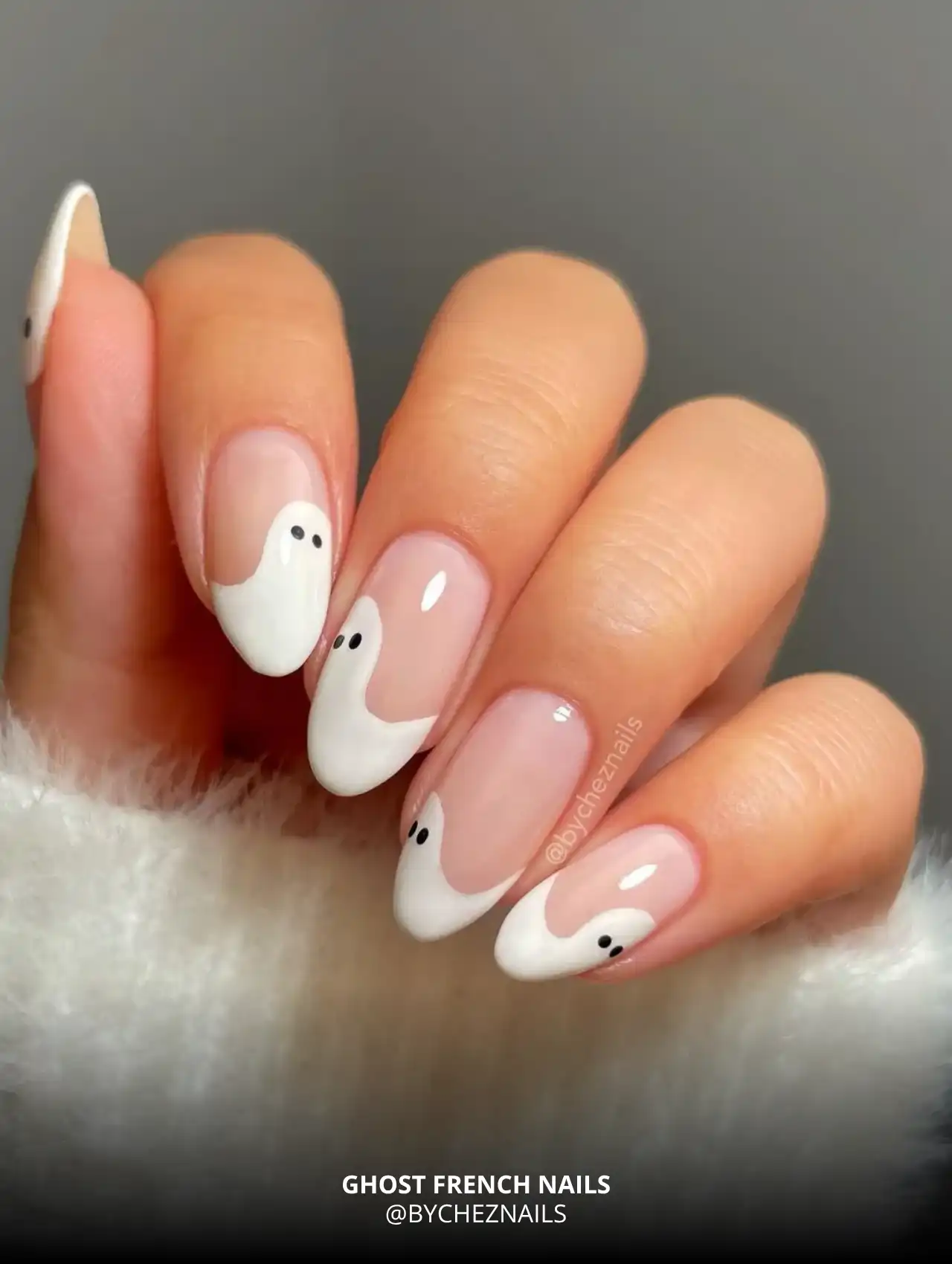 White ghost-shaped French tips on nude nails, trendy Halloween nails
