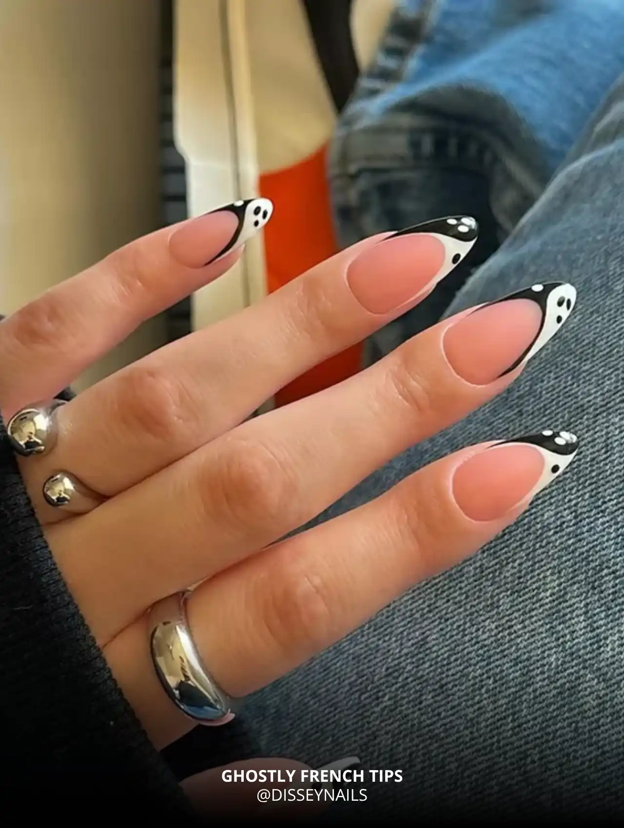 Almond-shaped nails with black-and-white ghost French tips, trendy Halloween nails
