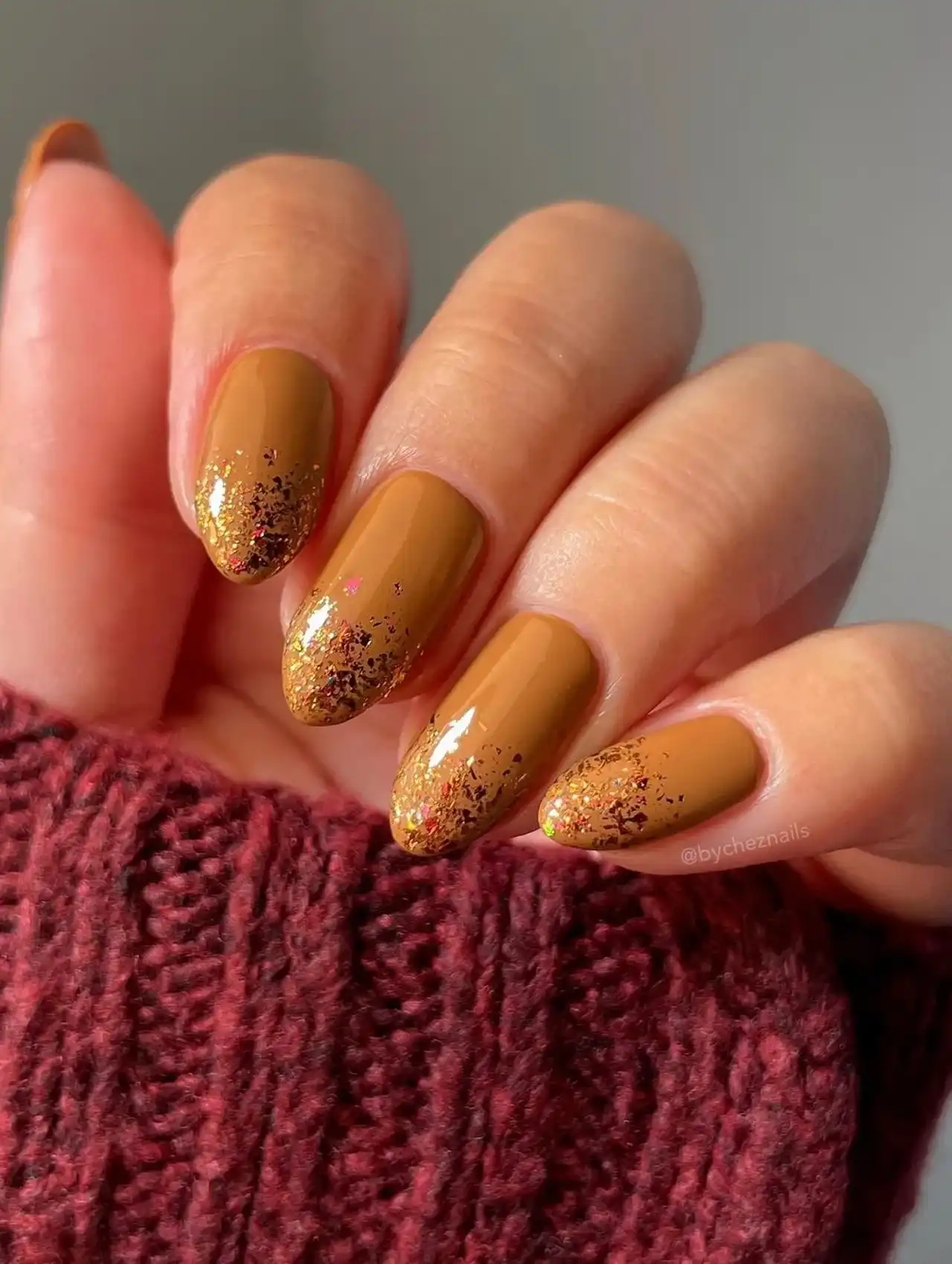 Cinnamon latte inspired november nail design with glitter accents