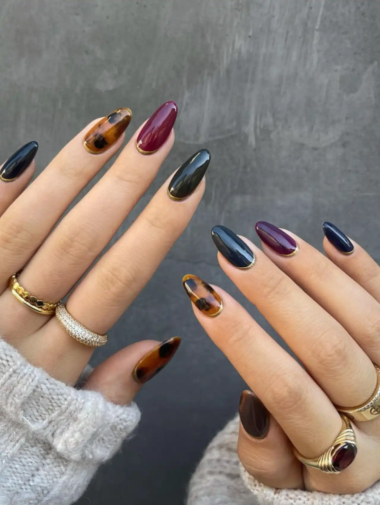 Classy jewel tone Thanksgiving nails in deep emerald, ruby, and sapphire shades
