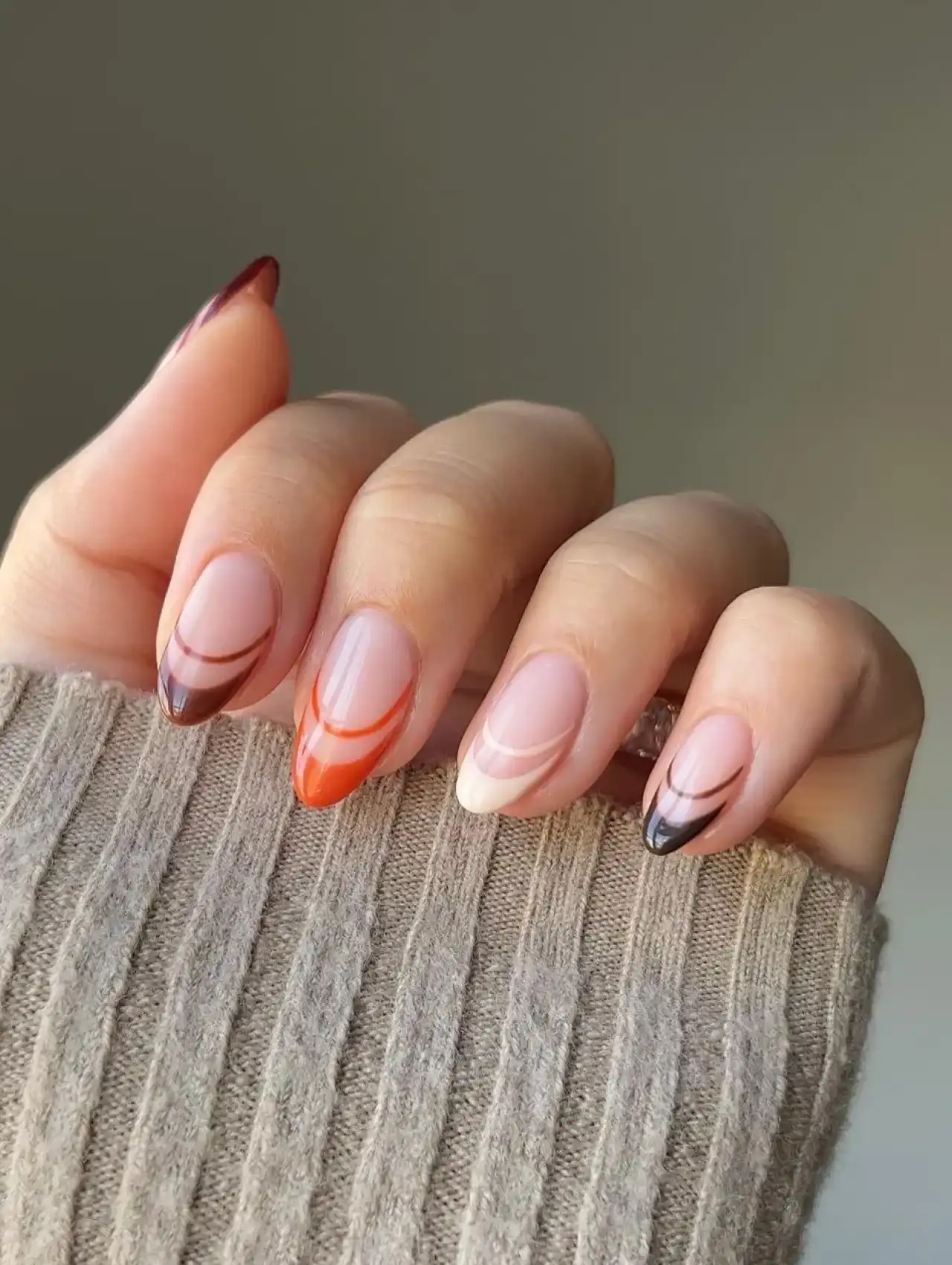 Double French tip Thanksgiving nails in red, orange, cream, and brown tones