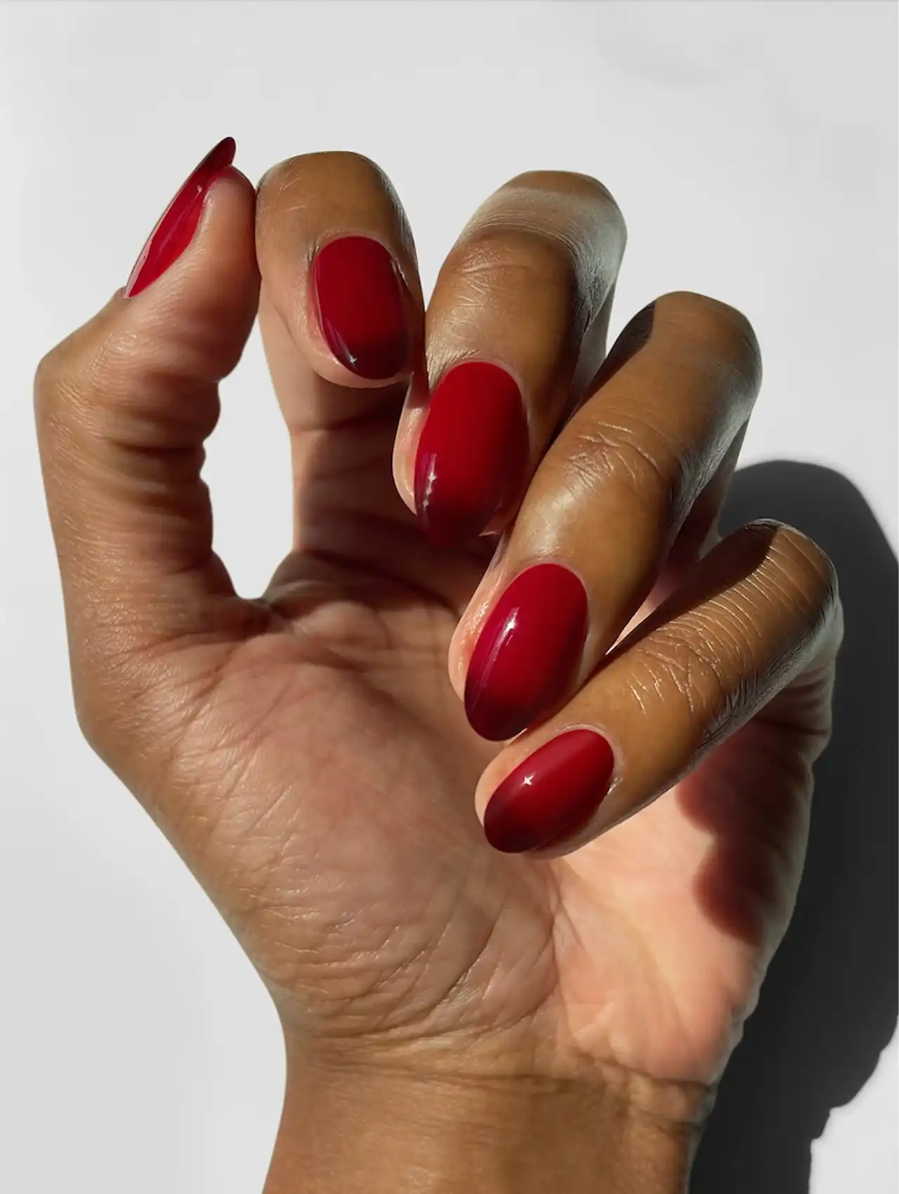 Moody ombre Thanksgiving nails fading from deep burgundy to nude