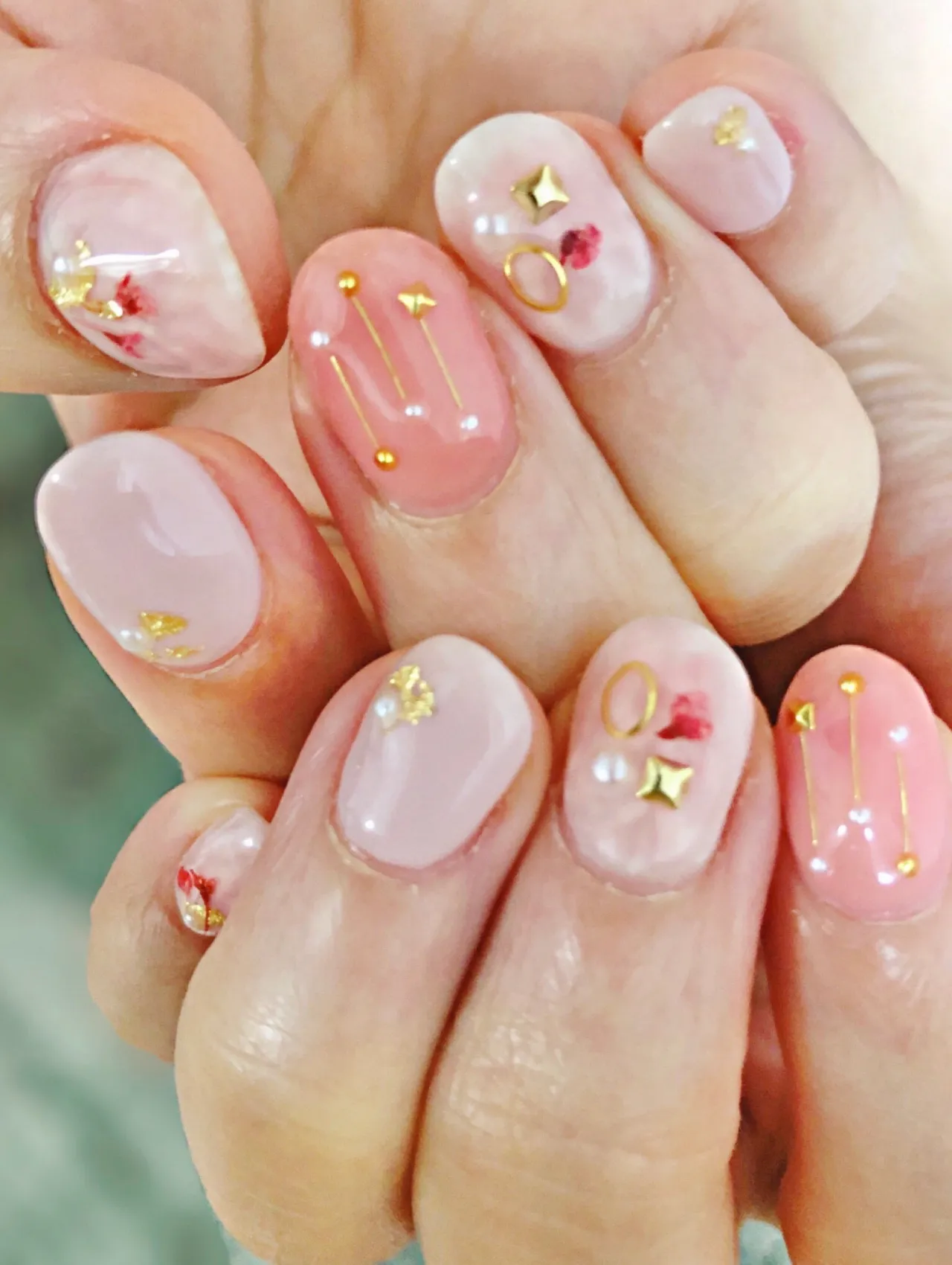 Celebrity Christmas Nail Art 2025 design with pink tones, gold accents, and festive detailing, perfect for Celebrity Christmas Nail inspiration.