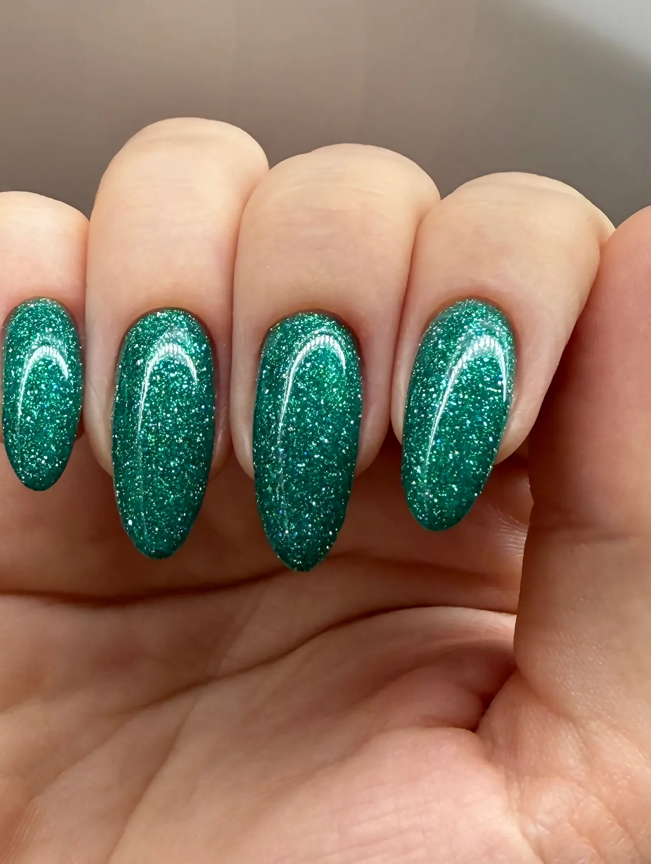 Instagram Nail Idea Trend showcasing green glitter nails for the Christmas Nail Trends article.