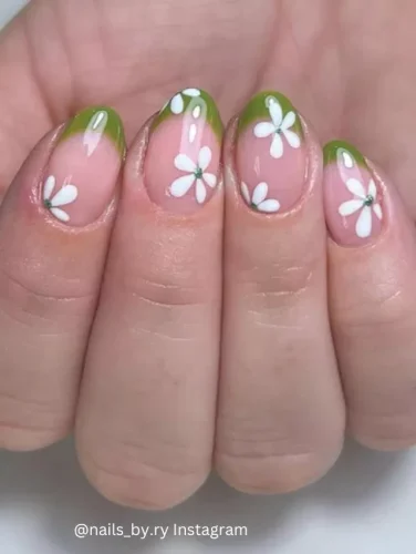 🌼💚 Embrace the freshness of spring with the "Botanical Winds" nail design. This delightful manicure features a glossy, translucent base adorned with vibrant green tips that seamlessly blend into a natural hue. Each nail is beautifully detailed with white daisy patterns, complete with tiny green rhinestones at the center, capturing the essence of a blossoming garden. This design is perfect for those who love a playful yet elegant look, ideal for spring picnics and garden parties. Unique keywords: vibrant green tips, white daisy patterns, garden essence nails.