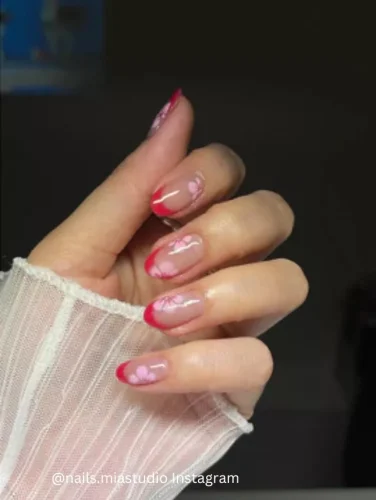 🌸💅 Step into the serene beauty of spring with the "Cherry Blossoms" nail design. This elegant manicure features a transparent glossy base with hints of soft pink gradient, mimicking the delicate hue of cherry blossoms. Artfully painted cherry blossom petals in a slightly darker shade of pink adorn each nail, enhanced with subtle white accents for a realistic floral effect. This design is perfect for those seeking a sophisticated yet understated look, ideal for springtime weddings or afternoon teas. Unique keywords: cherry blossom petals, pink gradient nails, sophisticated floral nails.