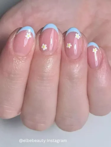 
"Dainty Skies"
🌼🌸💙 Reflect the serene skies of spring with the "Dainty Skies" nail design. This subtle and graceful manicure features a clear, glossy base with soft, sky blue tips that gently curve along the natural arch of each nail. Delicate small daisies with yellow centers and white petals are sparingly placed, adding a touch of spring's playful charm. Ideal for those who prefer a minimalist yet whimsical look, this design is suited for both casual outings and formal gatherings. Unique keywords: sky blue tips, delicate daisy accents, serene spring nails.