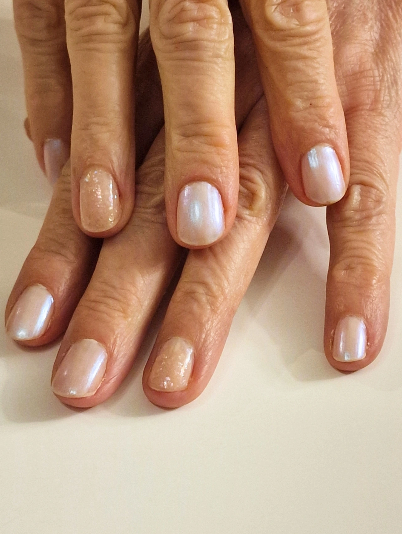 Classic Pearl Short Nails January Nails with pearly white polish on short nails.