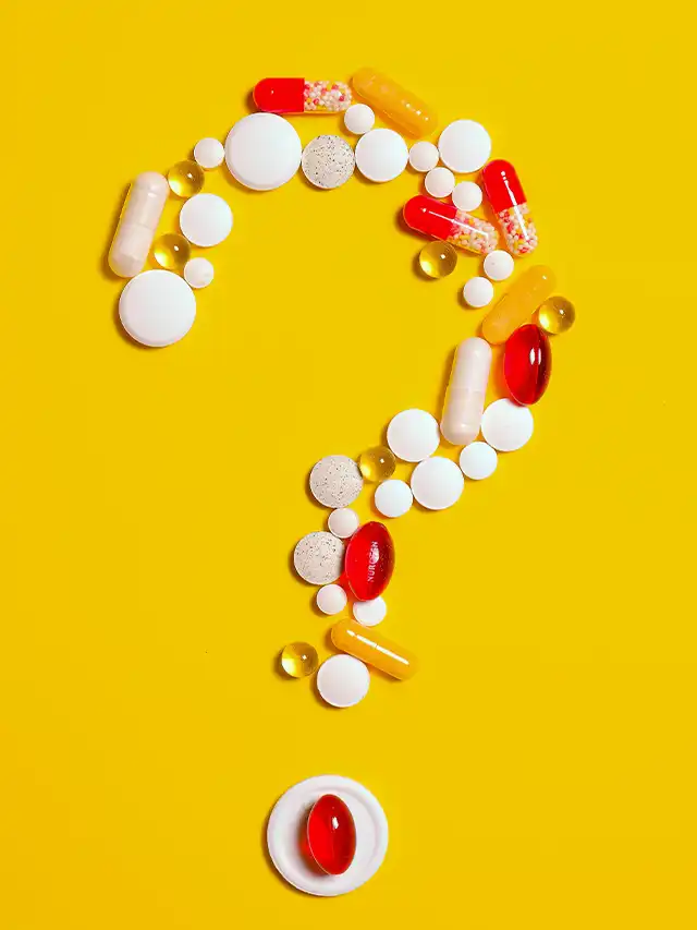 a question mark made of pills