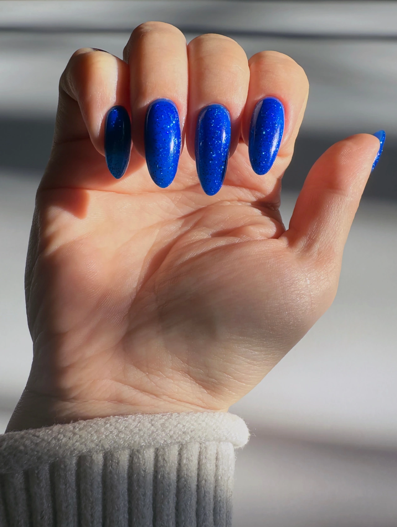 Midnight Blue Sparkle January Nails with deep blue glitter polish on long nails.