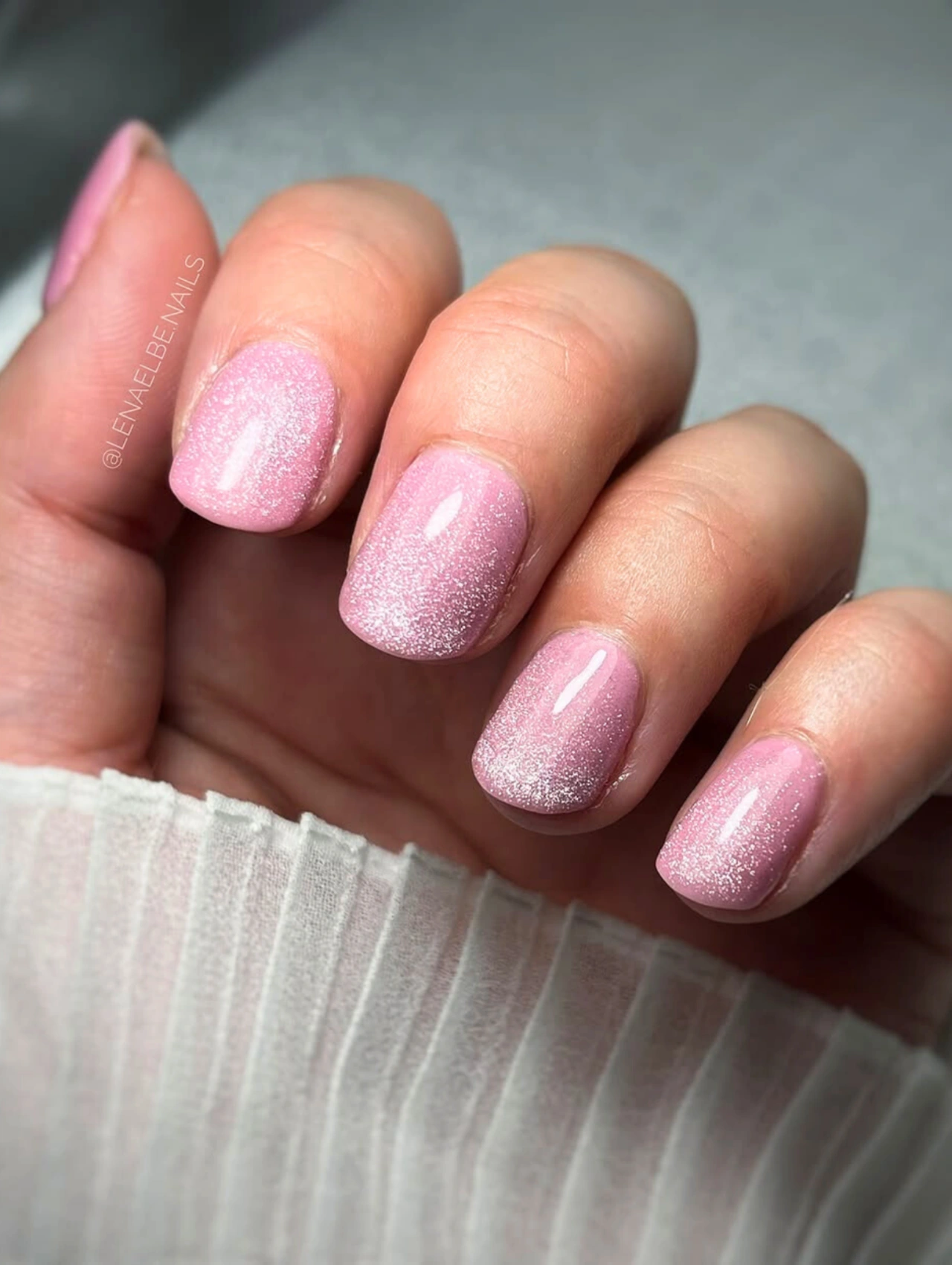 Soft Pink Shimmer Valentine’s Nails Dip Powder with glossy short nails and a subtle glitter finish.