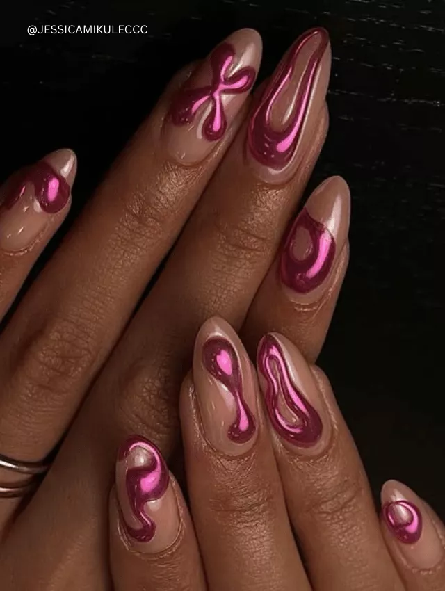 Pink nude almond nails with hot pink 3D chrome liquid drip designs.