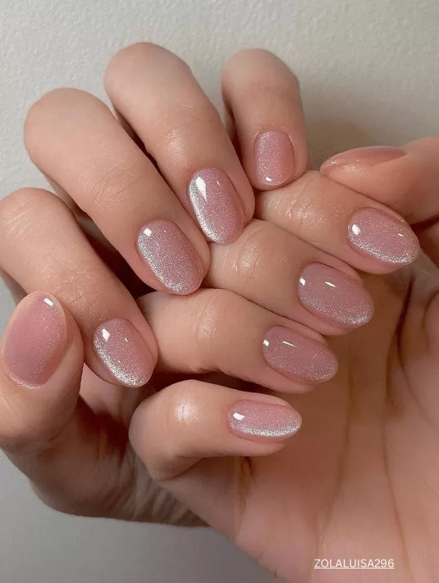 Soft pink velvet nails with a natural, glossy finish. 