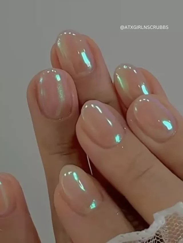 Short glossy nails with a sheer iridescent pearl finish.