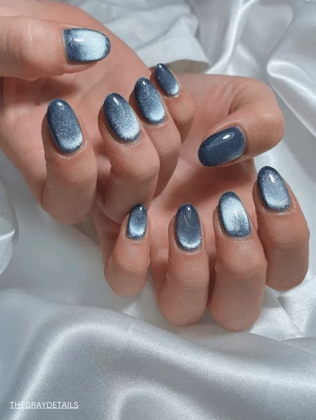 Soft baby blue velvet nails with a chrome-like shimmer.