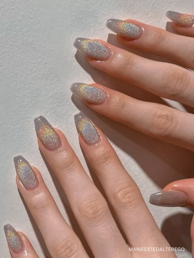 Iridescent holographic velvet nails with a prismatic glow.
