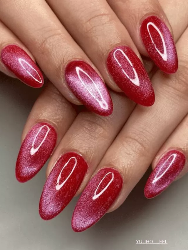 Vibrant pink velvet nails with a high-shine, soft-focus effect.