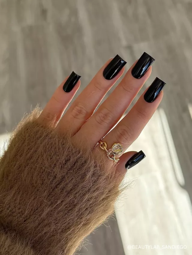 A timeless glossy black nail design with a sleek and sophisticated finish.