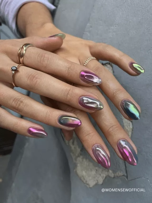 Oval-shaped nails with multicolor chrome and 3D melted effects.