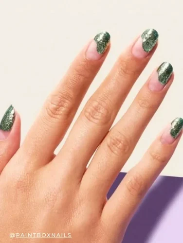 Stylish ombre glitter nail design with an emerald green finish