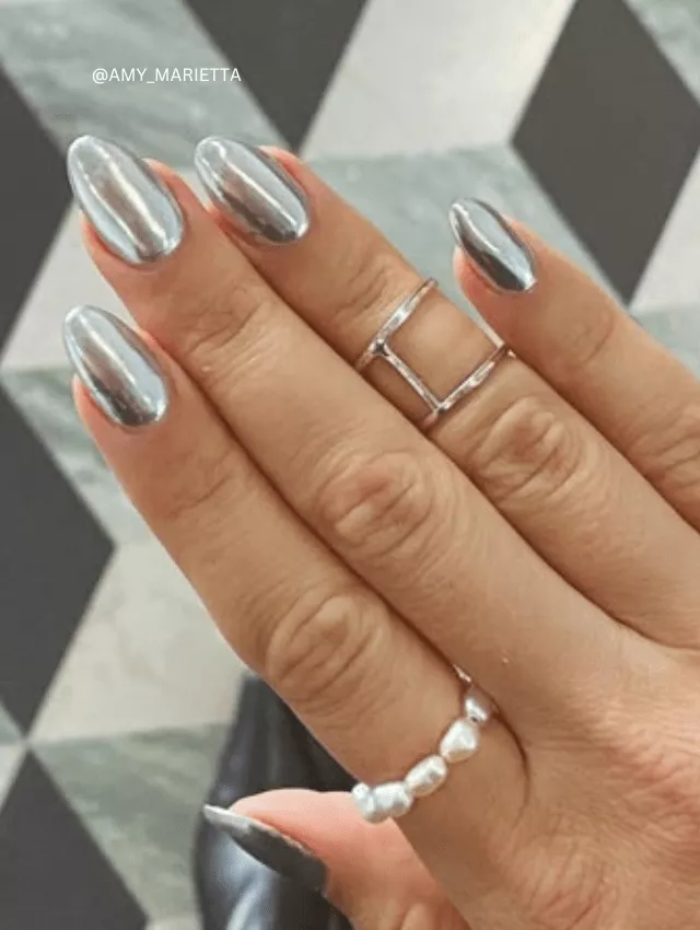 Almond-shaped nails with a full silver mirror chrome finish.