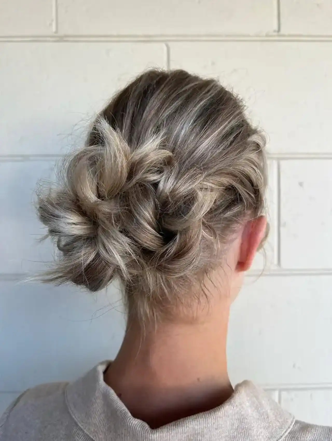 Messy low bun with twist - easy hairstyles for relaxed chic looks