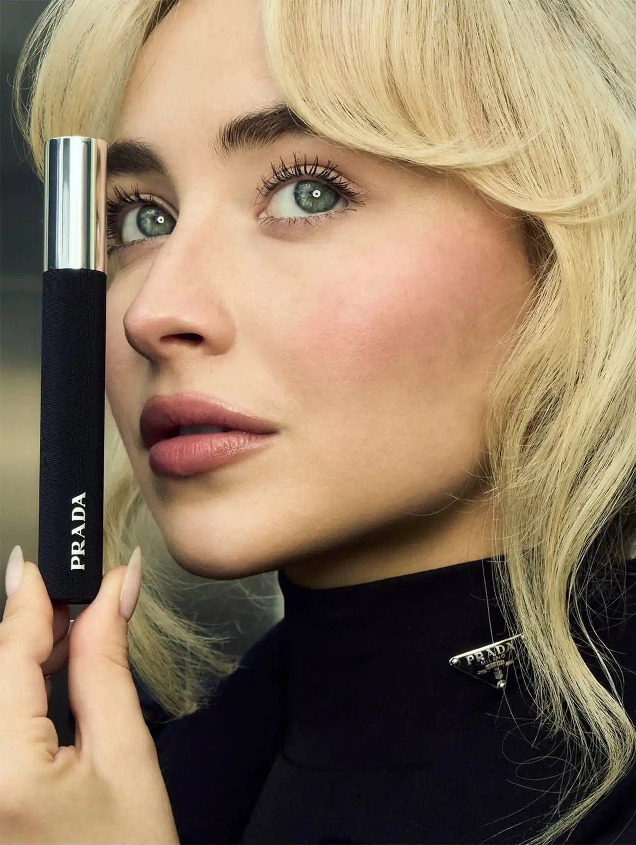 Sabrina Carpenter nails in natural nude polish during Prada campaign