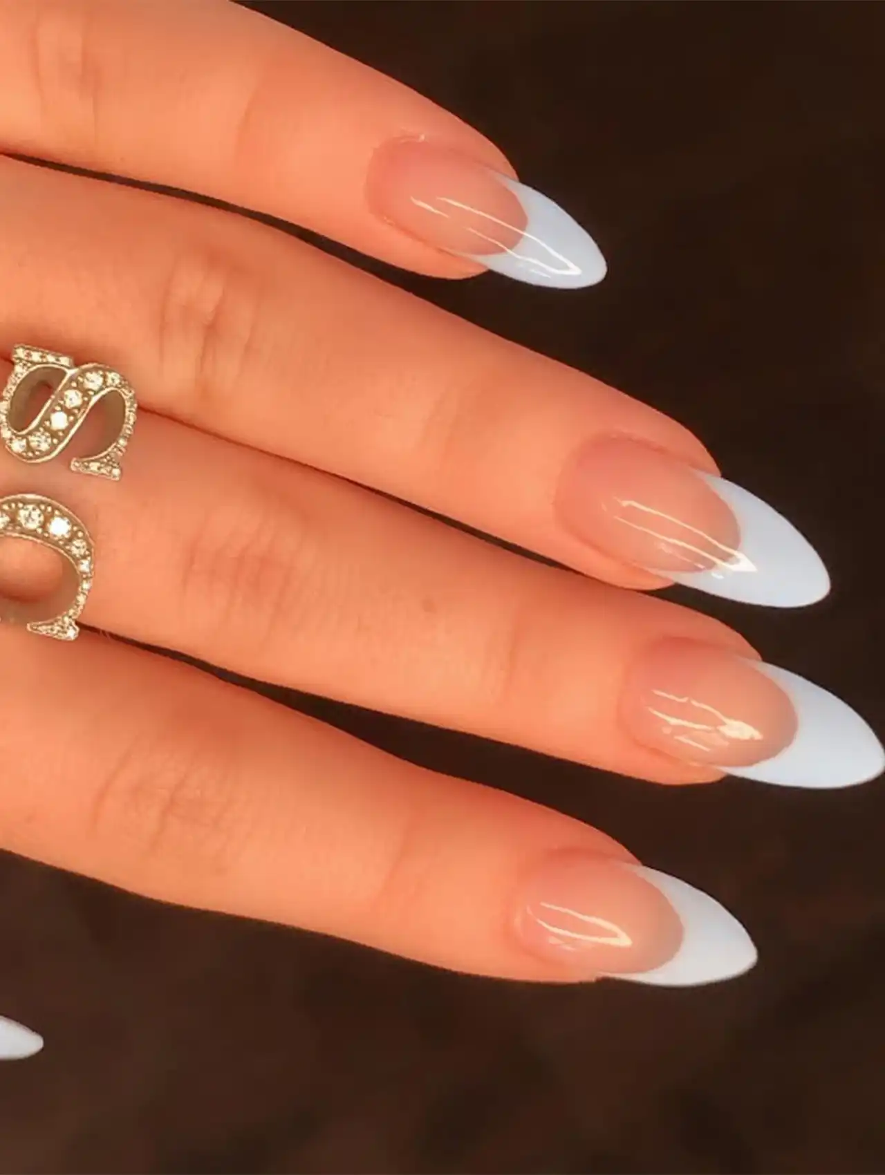 Sabrina Carpenter nails in glossy sky blue almond shape