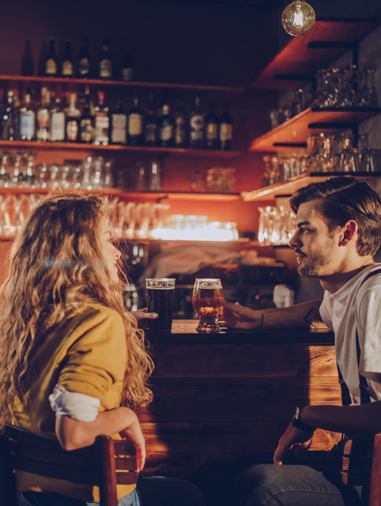 The Cops Showed Up Valentine’s Day Date, couple sitting at a bar facing tension during an awkward and unforgettable Valentine’s Day Date