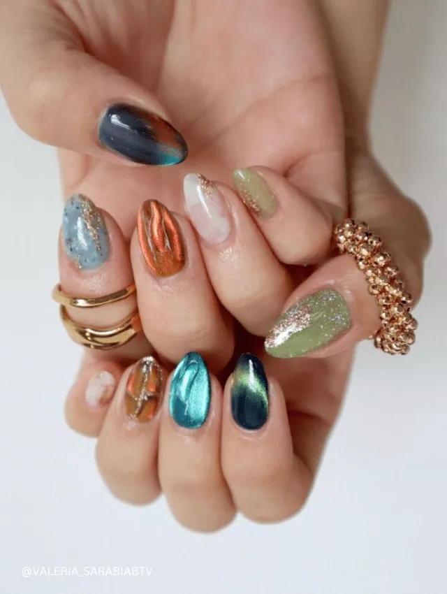 Mixed metallic and earthy-toned nails with shimmer, chrome, and marble effects for an eclectic festival vibe.