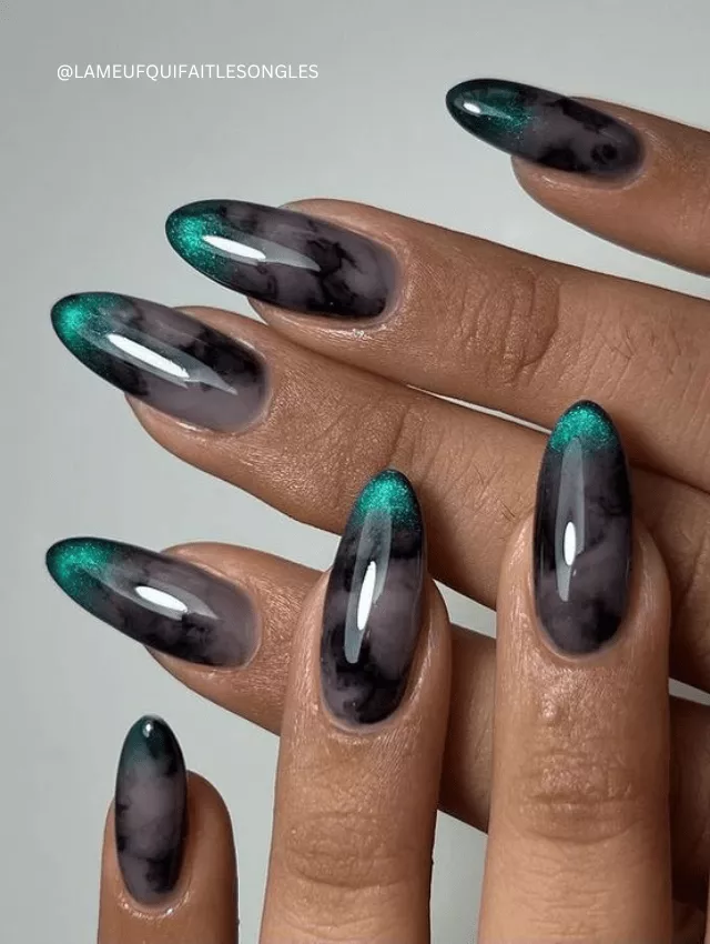 Black and green marble nails with a smoky ombré effect.