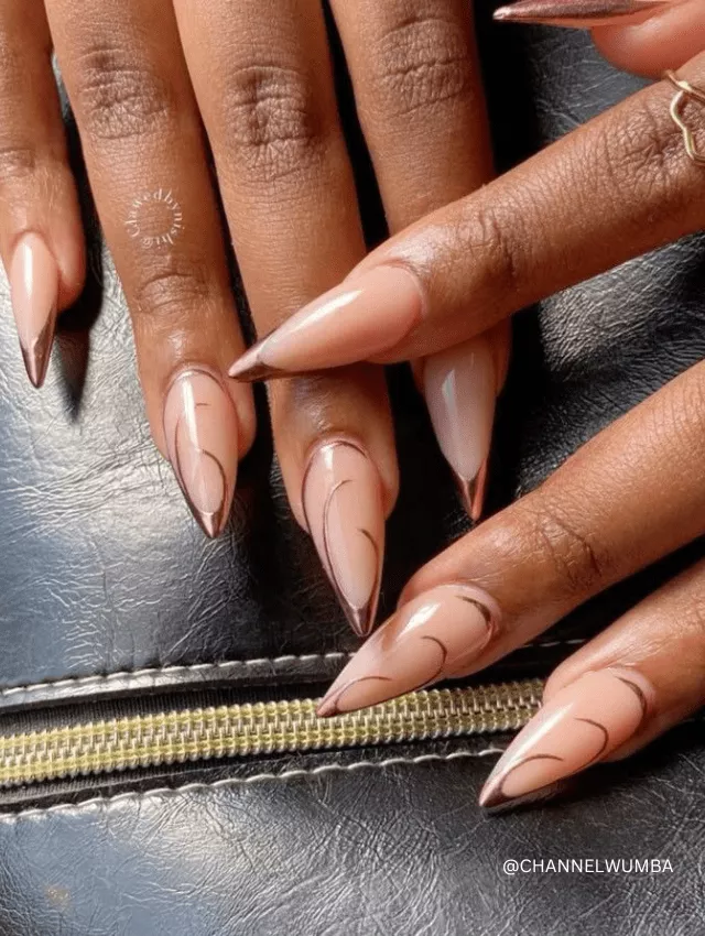 Long, almond nude nails with thin pink and burgundy French tip accents.